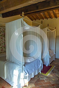 Beautiful bedroom with wooden four poster bed
