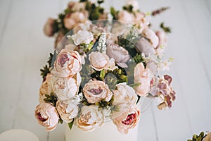 Beautiful beige flower bouquet in the box on the flloor