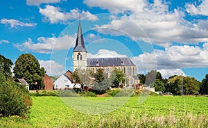 Beautiful belgian countryside landscape with rural village and church tower - Kessenich, Belgium
