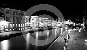 Beautiful Belgian houses at night along the river at Graslei photo