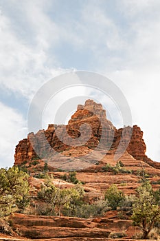 Beautiful Bell Rock at red rock formations in coconino national forest in Sedona Arizona USA against white cloud background. Copy
