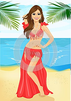 Beautiful belly dancer harem woman in a red stage costume on beach