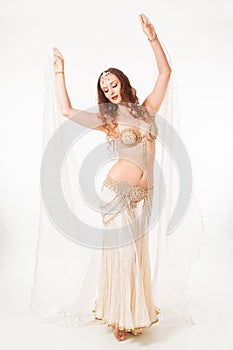 Beautiful belly dancer holding veil