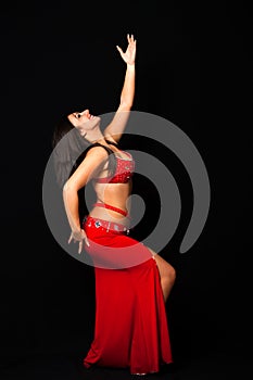 Beautiful belly dancer performing exotic dance