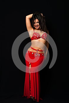 Beautiful belly dancer performing exotic dance