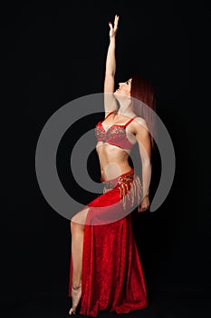 Beautiful belly dancer performing exotic dance