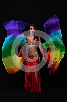 Beautiful belly dancer performing exotic dance