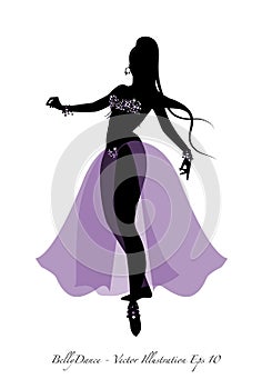 Beautiful belly dancer silhouette wearing exotic clothes photo