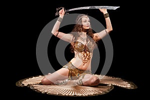 Beautiful belly dancer with sword