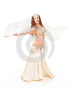 Beautiful belly dancer turning with veil