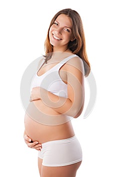 Beautiful belly of young attractive pregnant woman