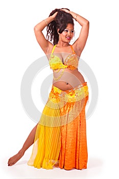 Beautiful bellydancer in yellow and orange