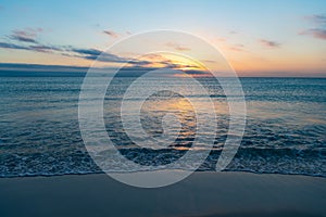 beautiful bermudas sunset with sea water on the summer beach