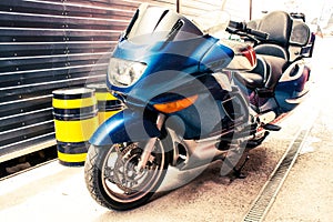 Beautiful big blue road bike with large mirrors