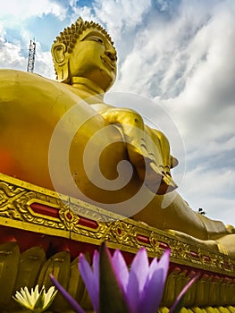 Beautiful Big Buddha Statue with a blue cloudy sky with light cl photo