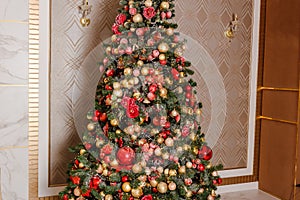 Beautiful big elegant Christmas tree with red balls. holiday