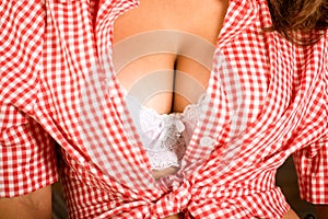 Beautiful big female breasts in bra. Woman breast, closeup. Plastic correction and surgery concept. Big boobs body parts