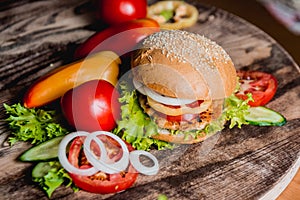 Beautiful big hamburger on a wooden table