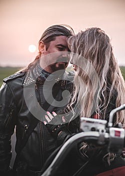 Beautiful biker couple outdoors.