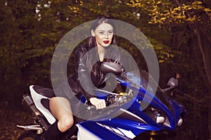 Beautiful Biker girl on a motorcycle