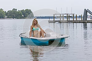 Beautiful Bikini Model Relaxing On A Boat