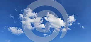 Beautiful billowing clouds (cumulus) in the deep blue sky.