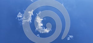 Beautiful billowing clouds (cumulus) in the deep blue sky.