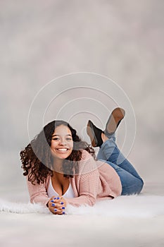 Beautiful, Biracial High School Senior with Curly Hair Smiling with Teeth