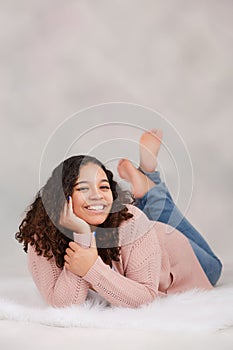 Beautiful, Biracial High School Senior with Curly Hair Smiling with Teeth