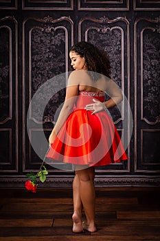 Beautiful, Biracial High School Senior wearing red prom dress