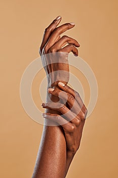 Beautiful black female hands pamper each other