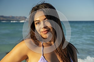 Beautiful black hair girl mexican latina portrait on baja california beach