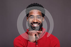 Beautiful black man in front of a dark background