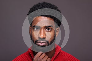 Beautiful black man in front of a dark background