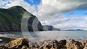 Beautiful black sand Whatipu Beach in Huia