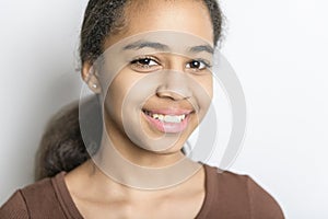 Beautiful black teen posing on studio white background