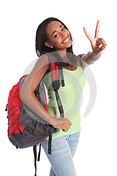 Beautiful black teenager school girl victory sign