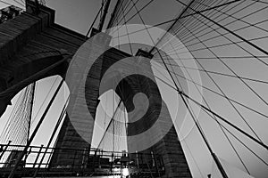 Beautiful black and white bridge photo in NYC, looking up at bridge wires