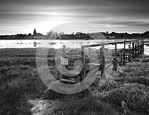 Beautiful black and white low tide landscape of Bosham Harbour w