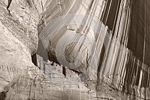 Beautiful black and white monochrome picture of Anazasi cave dwellings built in a cliff in Canyon de Chelly