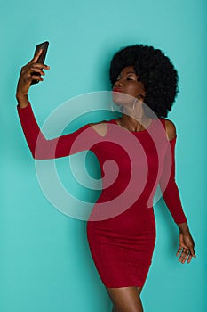 Beautiful Black Woman In Elegant Dress Is Taking A Selfie