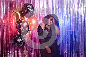 Beautiful black woman enjoying a party lifestyle. Birthday party, clubbing and holidays concept.