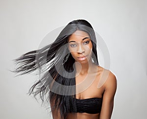 Beautiful black woman with long straight hair