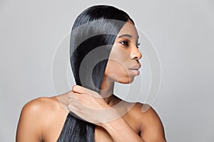 Beautiful black woman with long straight hair photo