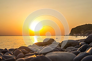 Beautiful blazing sunset landscape at black sea and orange sky above it as a background