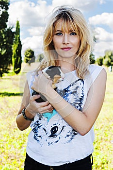 Beautiful blond blue eyes with Peruvian guinea pig animal