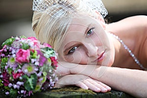 Beautiful blond bride holding bouquet