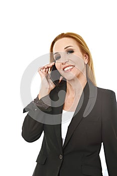 Beautiful blond businesswoman talking on mobile phone smiling happy and confident