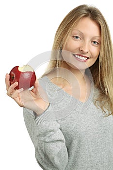 Beautiful blond eating an apple