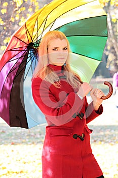 Beautiful blond female under umbrella